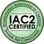 A green seal that says iac 2 certified